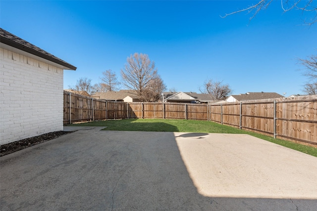 view of yard with a patio area and a fenced backyard