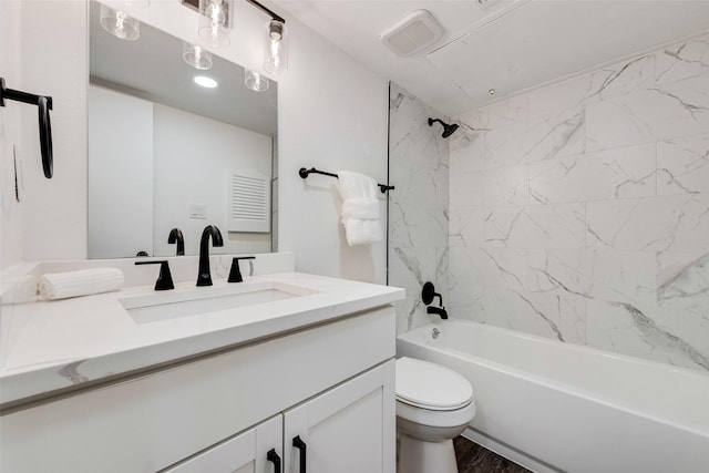 bathroom with bathing tub / shower combination, visible vents, toilet, vanity, and wood finished floors