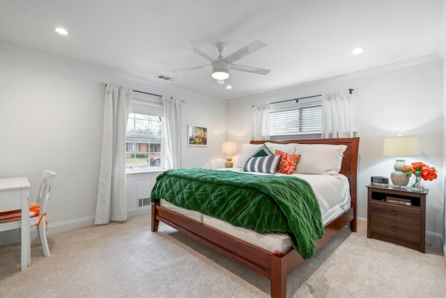 bedroom with visible vents, ornamental molding, and carpet flooring