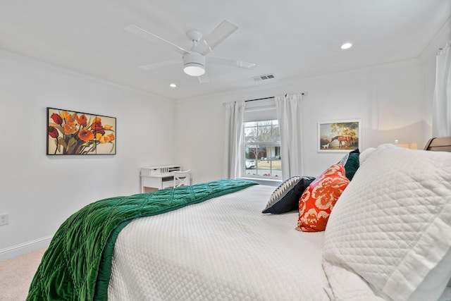 bedroom featuring baseboards, visible vents, a ceiling fan, crown molding, and carpet floors