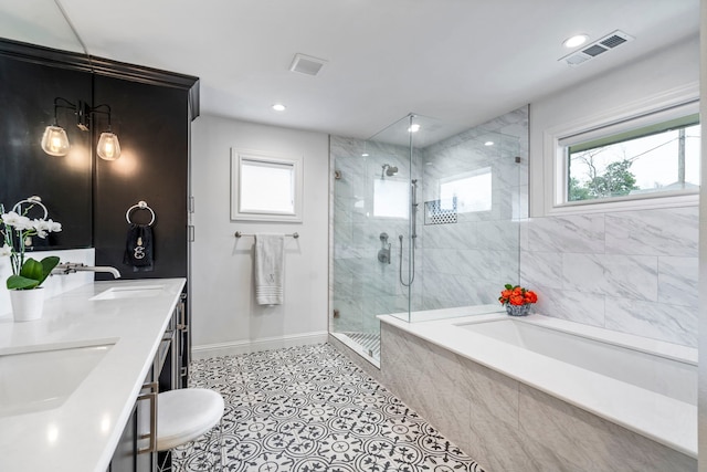 full bath with a stall shower, baseboards, visible vents, a sink, and a bath