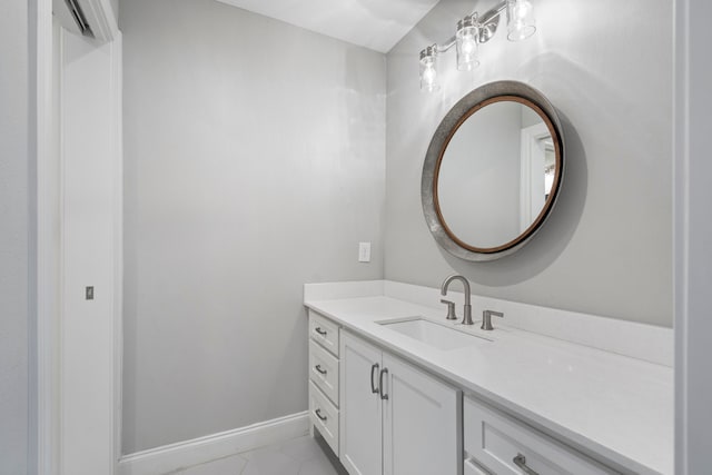 bathroom featuring baseboards and vanity