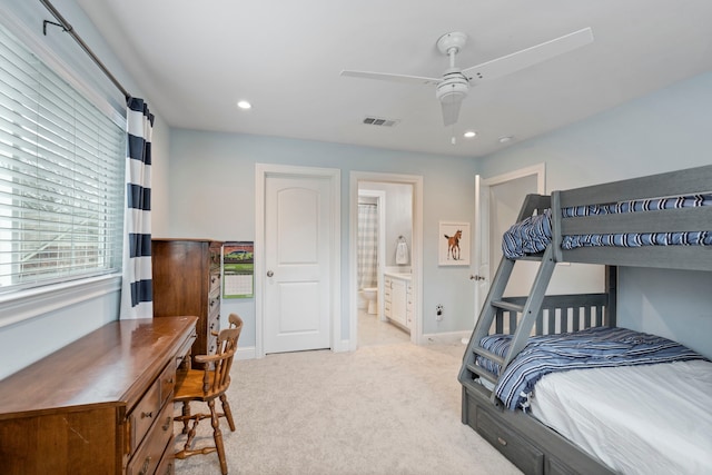 carpeted bedroom featuring recessed lighting, a ceiling fan, visible vents, baseboards, and ensuite bath