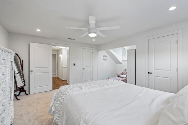 bedroom with carpet floors, ceiling fan, visible vents, and recessed lighting