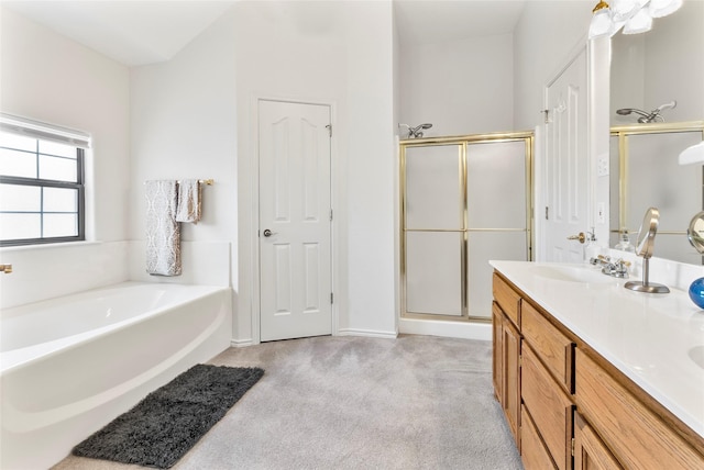 bathroom featuring carpet, double vanity, a stall shower, a sink, and a bath