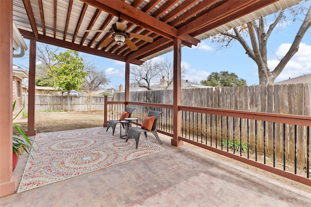 view of patio with a ceiling fan and a fenced backyard