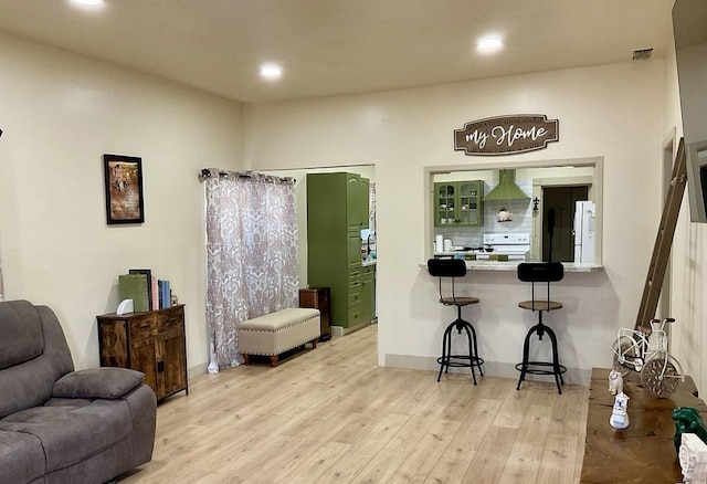 interior space featuring light wood-style flooring, visible vents, and recessed lighting