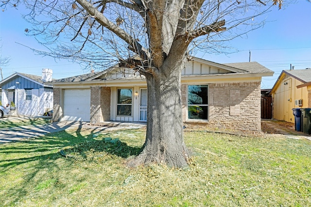 523 Parker Cir, Garland, TX 75040 - view of front facade featuring a garage, a shingled roof, a front lawn, and board and batten siding