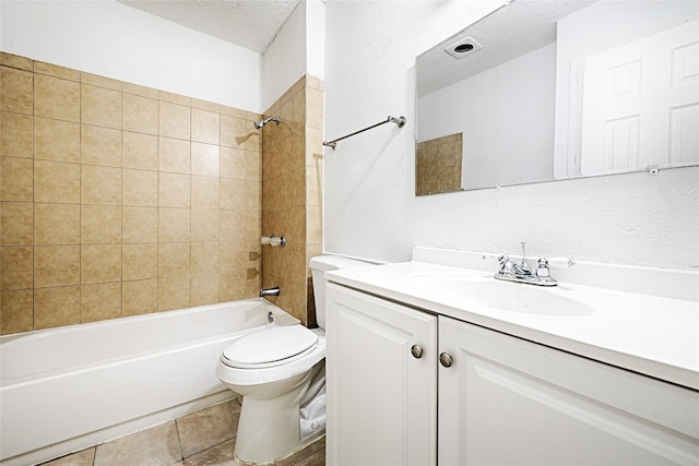 bathroom with bathtub / shower combination, toilet, a textured ceiling, vanity, and tile patterned floors