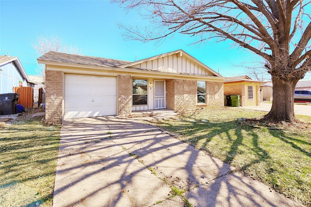 ranch-style home featuring brick siding, board and batten siding, a garage, driveway, and a front lawn