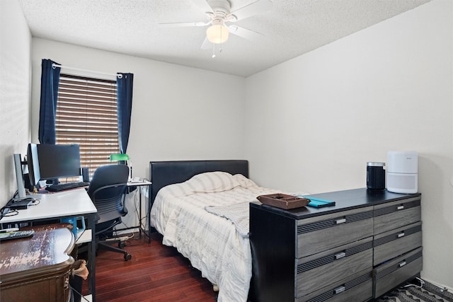 bedroom with dark wood-style floors, ceiling fan, and a textured ceiling