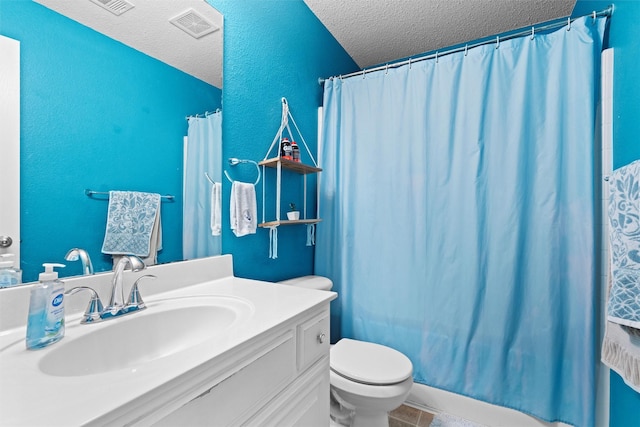 bathroom featuring a textured ceiling, toilet, vanity, visible vents, and a shower with curtain