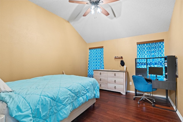 bedroom featuring lofted ceiling, ceiling fan, a textured ceiling, wood finished floors, and baseboards