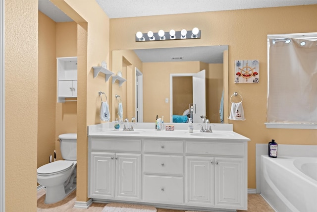 full bath with visible vents, a sink, toilet, and double vanity