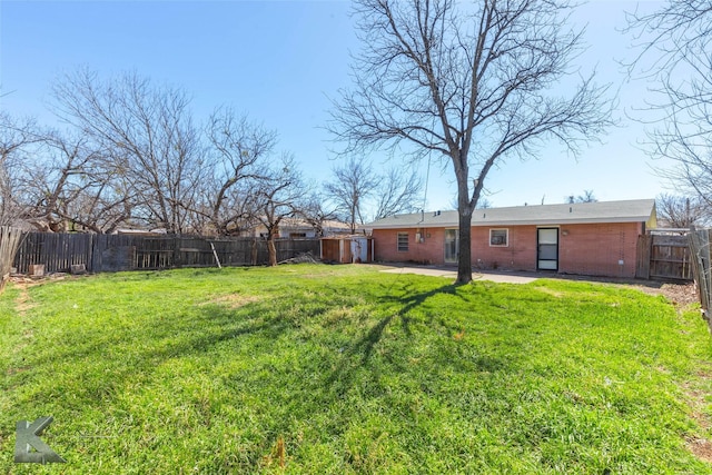 view of yard featuring a patio and a fenced backyard