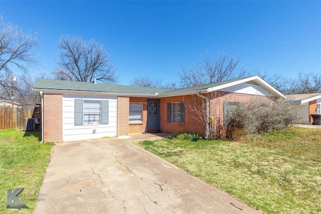 single story home with a front lawn, central AC unit, fence, and brick siding