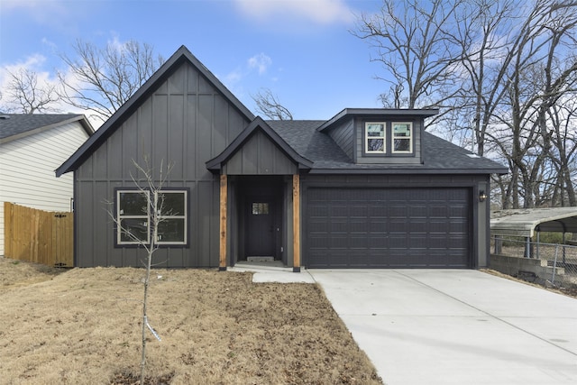 view of front of home with concrete driveway, a shingled roof, board and batten siding, and fence