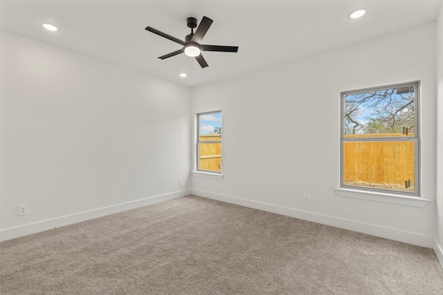 carpeted empty room with a ceiling fan, recessed lighting, and baseboards