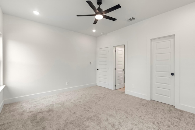 unfurnished bedroom featuring carpet floors, recessed lighting, visible vents, and baseboards