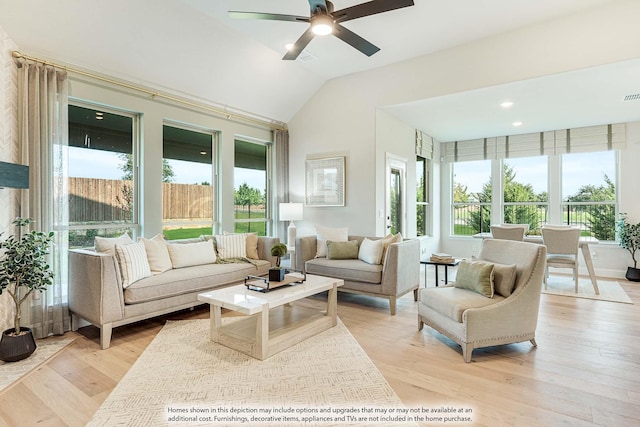 sunroom with a ceiling fan, lofted ceiling, and visible vents