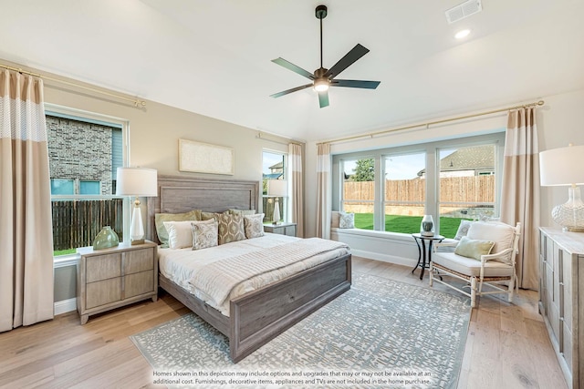 bedroom featuring light wood-type flooring, baseboards, visible vents, and ceiling fan