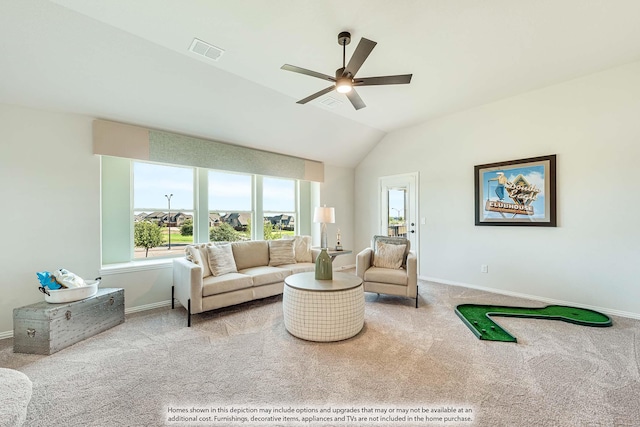 carpeted living room featuring vaulted ceiling, a ceiling fan, visible vents, and baseboards