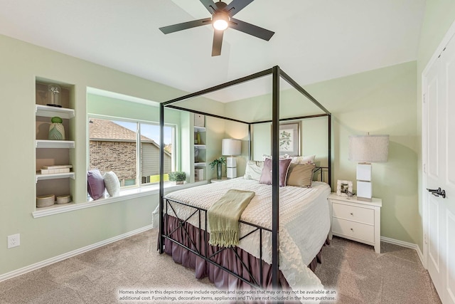 carpeted bedroom featuring baseboards and a ceiling fan