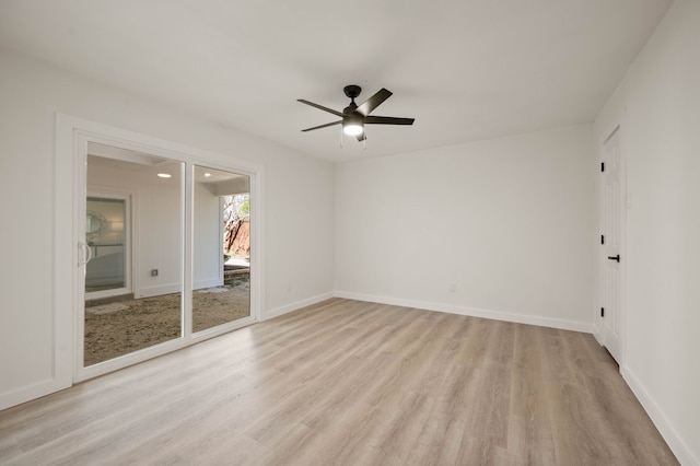 unfurnished room featuring ceiling fan, light wood-style flooring, and baseboards