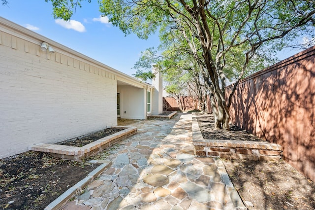 view of yard featuring a patio area and a fenced backyard