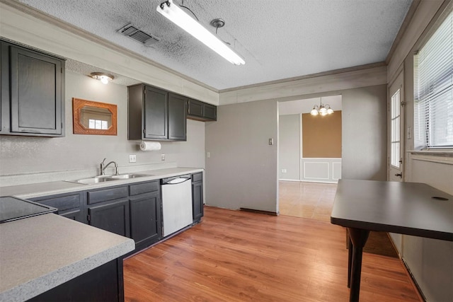 kitchen with light countertops, visible vents, a sink, light wood-type flooring, and dishwasher