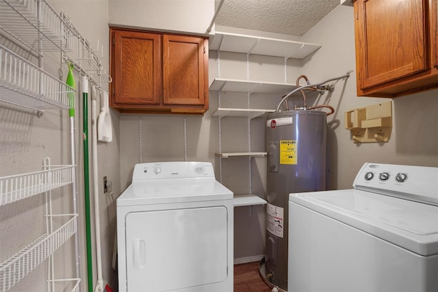 laundry room with water heater, separate washer and dryer, and cabinet space