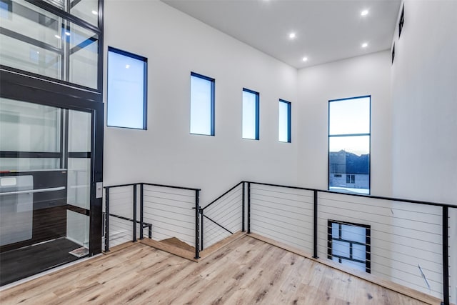 interior space featuring wood finished floors and recessed lighting