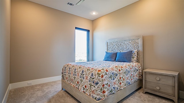 bedroom with baseboards, visible vents, and carpet flooring