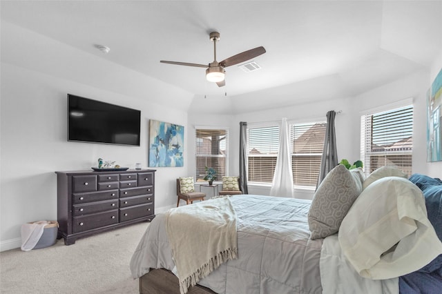 bedroom featuring carpet floors, visible vents, baseboards, and multiple windows