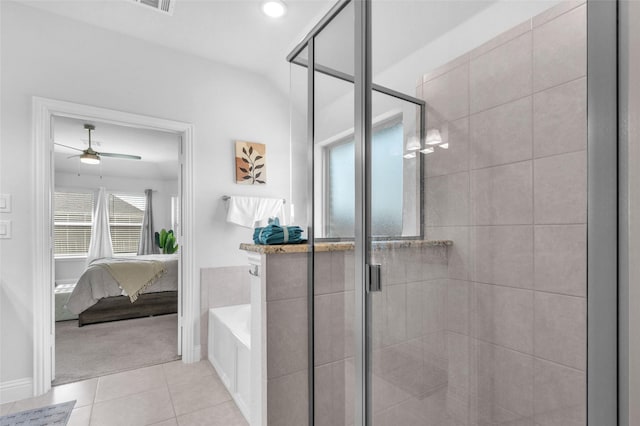 bathroom featuring tile patterned floors, a shower stall, a garden tub, and ensuite bathroom