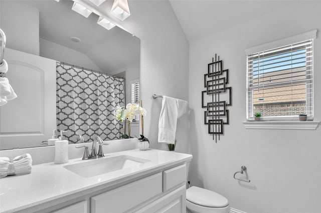 full bath with a shower with shower curtain, vaulted ceiling, vanity, and toilet