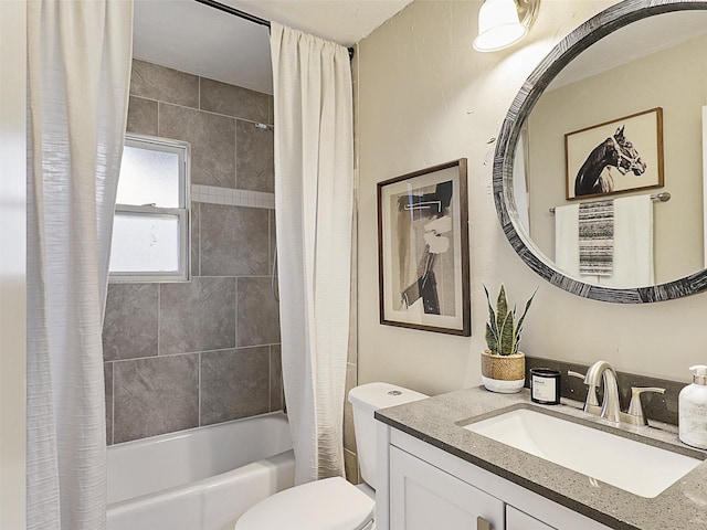 full bathroom featuring shower / tub combo, vanity, and toilet