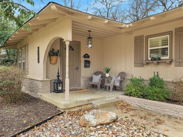 entrance to property featuring stone siding