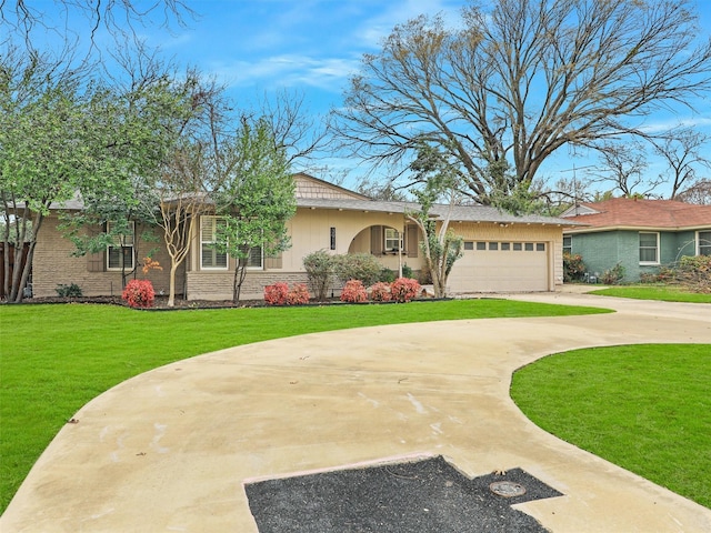 ranch-style house with an attached garage, driveway, and a front lawn