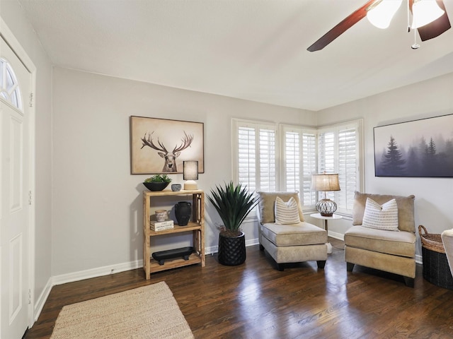 sitting room featuring wood finished floors, a ceiling fan, and baseboards