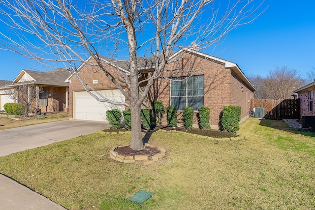 single story home with concrete driveway, an attached garage, fence, central air condition unit, and brick siding