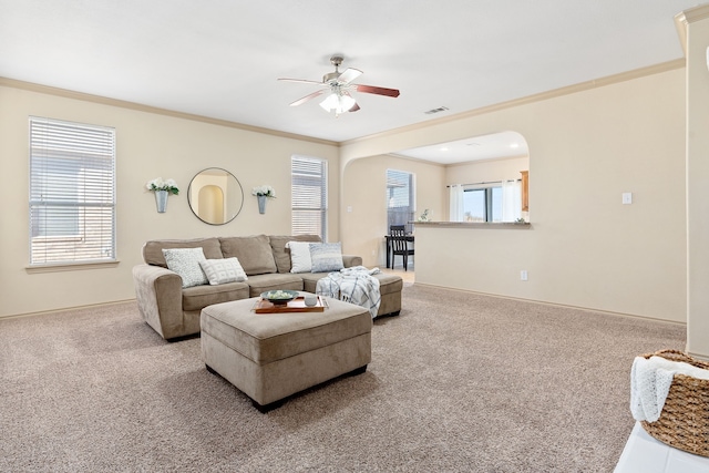 living room with carpet, a healthy amount of sunlight, and visible vents