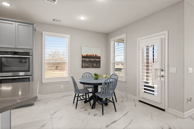 dining room featuring recessed lighting, visible vents, baseboards, and marble finish floor