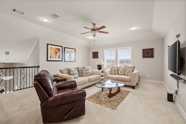 living room featuring visible vents, light colored carpet, and baseboards