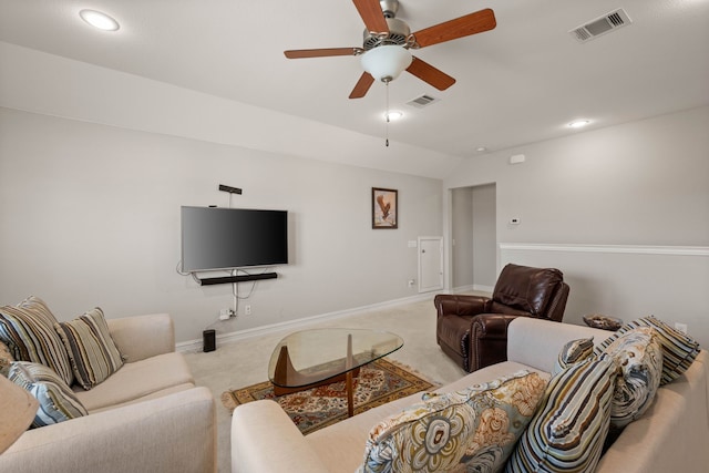 living room with vaulted ceiling, carpet, visible vents, and baseboards