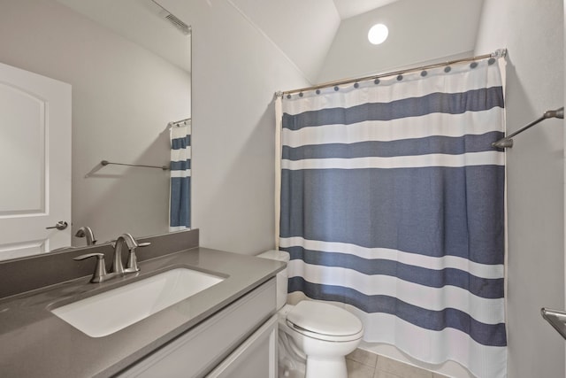 full bathroom with vanity, a shower with shower curtain, vaulted ceiling, tile patterned floors, and toilet