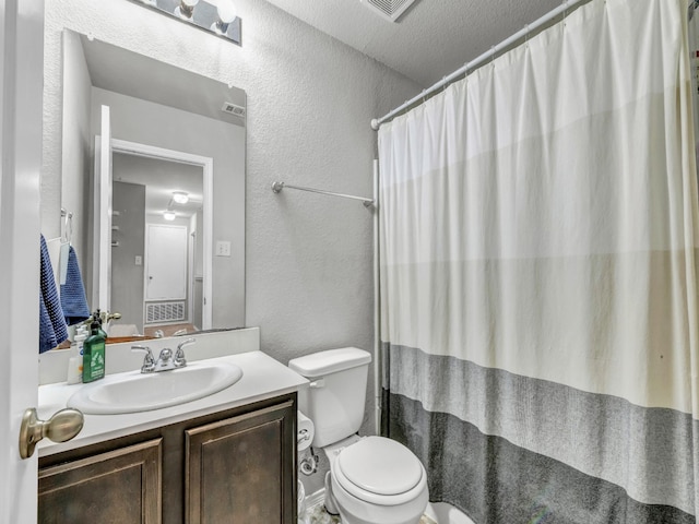 full bathroom with visible vents, a textured wall, a shower with shower curtain, toilet, and vanity