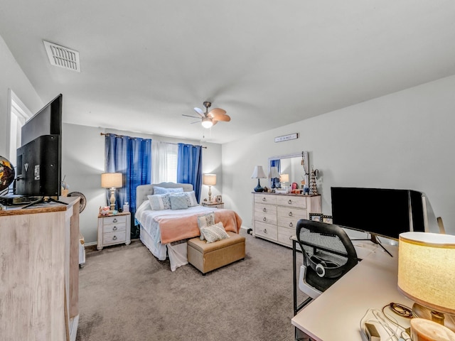 bedroom with ceiling fan, visible vents, and light colored carpet