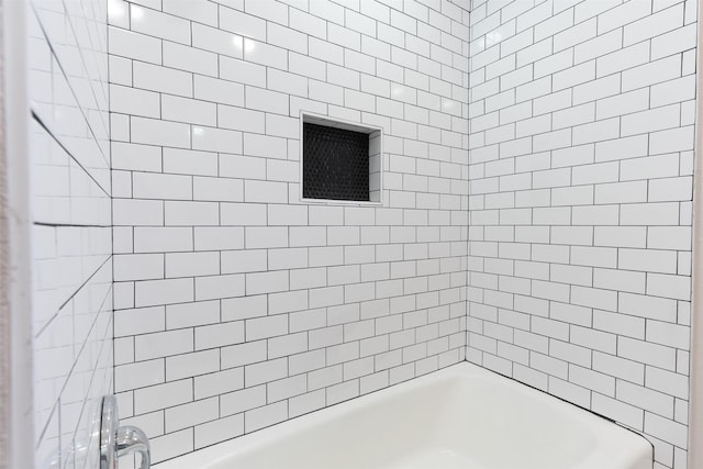 bathroom with shower / washtub combination