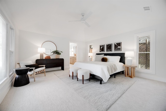 bedroom featuring a ceiling fan, carpet, visible vents, and ensuite bathroom